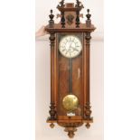 A late 19th Century eight day strike single weight regulator wall clock with Roman numerals to a