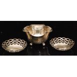 A hallmarked silver petal shaped sugar basin raised on three ball feet,
