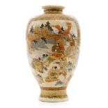 A 19th Century Japanese Meiji period Satsuma vase of footed form decorated in the round with