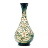 A Moorcroft Pottery bottle vase decorated in the Carousel Jasmine pattern designed by Rachel Bishop,