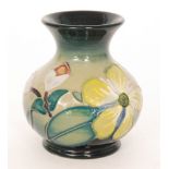 A Moorcroft Pottery vase decorated in the Hypericum pattern designed by Rachel Bishop,