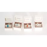 Four boxed charms stamped Pandora and ALE, examples to include pink ribbon, orange murano glass,