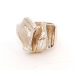 A 1980s Finnish Sterling silver matt finished ring of abstract design,