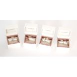 Four boxed charms stamped Pandora and ALE, examples to include cherry blossom flowers,
