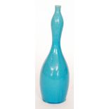 An early 20th Century Chinese vase of slender double gourd form, the whole glazed in turquoise,