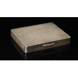 A hallmarked silver rectangular engine turned box with gilded raised thumb piece,