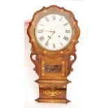 An early 20th Century mahogany eight day drop dial wall clock with Roman numerals to a white