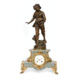 A late 19th to early 20th French spelter gilt mantle clock modelled with a figure of a boy holding