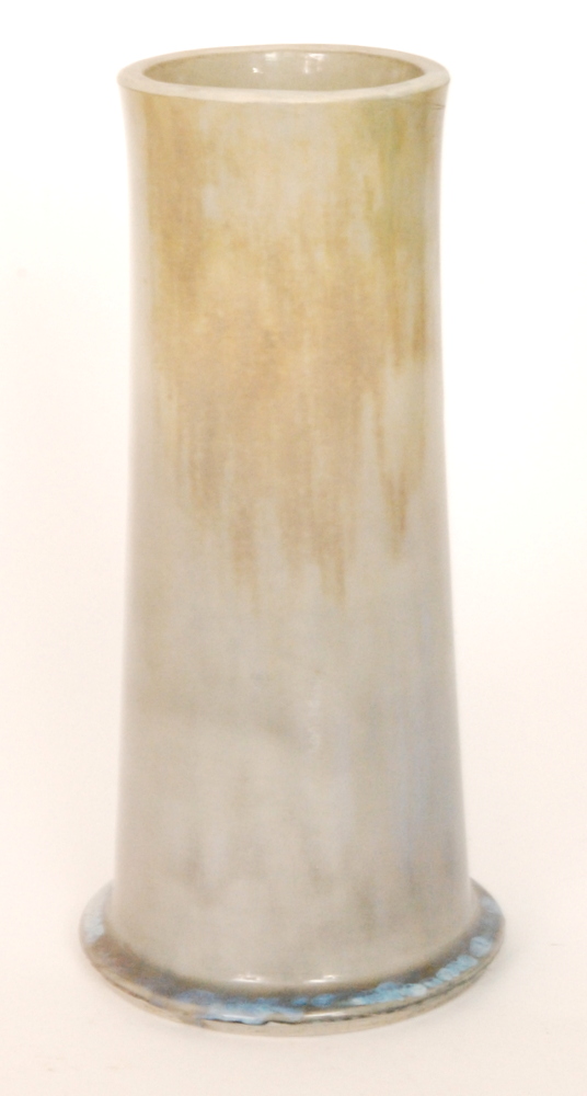 A large Ruskin Pottery footed cylinder vase decorated with a streaked yellow to blue with pale blue