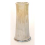 A large Ruskin Pottery footed cylinder vase decorated with a streaked yellow to blue with pale blue