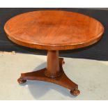 A Victorian mahogany circular occasional table on fluted octagonal pedestal over a tricorn base,