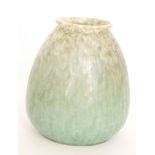 A Ruskin Pottery crystalline glaze vase decorated in a mottled and streaked green over a mustard