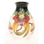 A Moorcroft Pottery baluster vase decorated in the Anna Lily pattern, designed by Nicola Slaney,