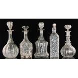 A group of 19th Century and later clear glass decanters comprising a pillar moulded bell form
