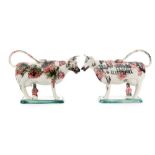 A mirrored pair of early 19th Century creamware cow creamers and covers each with a seated milkmaid,