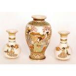 An early 20th Century Japanese export Satsuma vase of footed baluster form decorated with ladies in