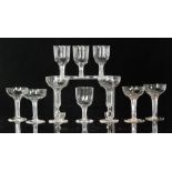 A group of late 19th Century hollow stem Champagne glasses comprising a set of four with slender