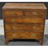 A George III oak straight front chest of two short over three long drawers,
