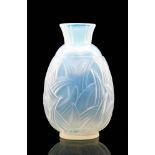 A 1930s Sabino glass vase of footed ovoid form with flared neck,