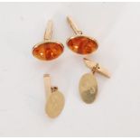 A modern pair of 9ct hallmarked amber set swivel cufflinks,