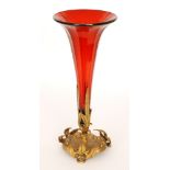 A large late 19th Century ruby glass epergne of faceted trumpet form raised on a gilt metal base