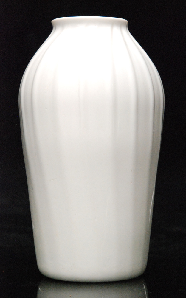 An 18th Century opaque white glass vase circa 1760 of shouldered form with wrythen moulded