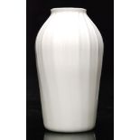 An 18th Century opaque white glass vase circa 1760 of shouldered form with wrythen moulded