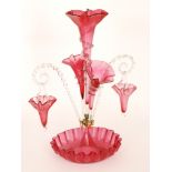 A large late 19th Century Stourbridge ruby glass epergne with a deep frill rim bowl rising to a