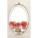 A large late 19th Century Stourbridge glass girondal wall mirror with oval bevelled edge mirror