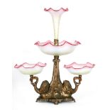 A late 19th Century table centre with a cast metal base decorated with a pair of swans each