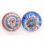 An early 20th Century John Walsh Walsh glass paperweight with rings of millefiori canes in pink,