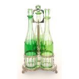 A late 19th Century Stourbridge three bottle glass decanter stand,