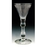 An 18th Century light baluster drinking glass circa 1730,