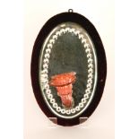 A late 19th Century Stourbridge glass girondal wall mirror with a red velvet mounted oval mirror
