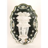 A late 19th Century Stourbridge glass girondal wall mirror of shaped oval outline with reverse cut