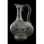 A mid 19th Century glass bellied carafe,