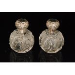 A pair of early 20th Century John Walsh Walsh crystal glass scent bottles of globular form with