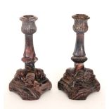 A pair of late 19th Century Davidson purple malachite pressed glass candlesticks,