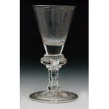 An 18th Century baluster drinking glass circa 1730,