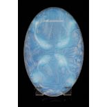 A large 1930s Verlys glass plaque, of oval form with relief moulded fish in an opalescent finish,