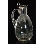 A late 19th Century crystal glass decanter designed by Dr Christopher Dresser of drawn fluted ovoid