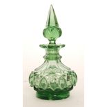 An early 20th Century Bohemian glass scent bottle of footed squat form with spire form stopper,