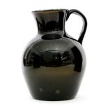 A large late 18th Century Nailsea style jug circa 1790 of shouldered form with flared neck and