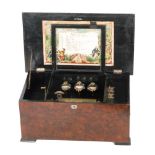 A bells-in view musical box playing ten airs, serial No 10057 with butterfly strikers and tune card,