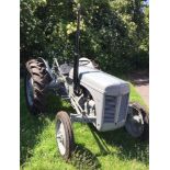 A 1951 Ferguson TEA20 tractor painted grey, 6 volt petrol with two furrow plough,