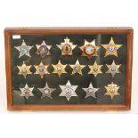 A collection of late 20th Century American enamelled sheriff and deputy sheriff badges to include