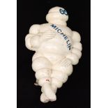 A later painted hard plastic model of the Michelin Man on metal bracket,