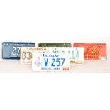 A collection of 1980s to 2000 American licence number plates to include Kentucky, Louisiana,