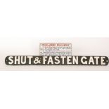 A cast iron railway 'Shut and Fasten' gate sign,