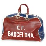 A 1970s claret and blue twin handled kit bag, one side named C.